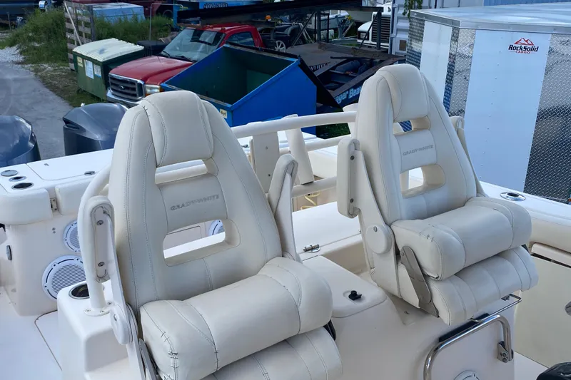  Yacht Photos Pics 2018 Grady-White Canyon 306 boat seats, white leather, outdoor setting.