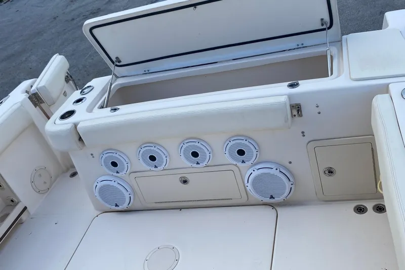  Yacht Photos Pics 2018 Grady-White Canyon 306 boat interior with storage compartments and speakers.