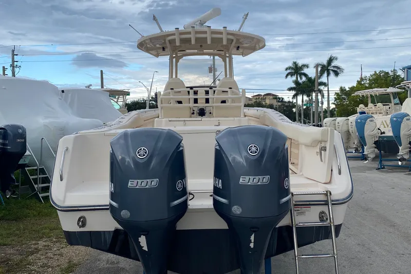  Yacht Photos Pics 2018 Grady-White Canyon 306 boat with twin Yamaha 300 engines, docked outdoors.