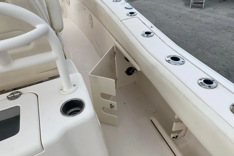  Yacht Photos Pics 2018 Grady-White Canyon 306 boat interior with rod holders and storage compartment.