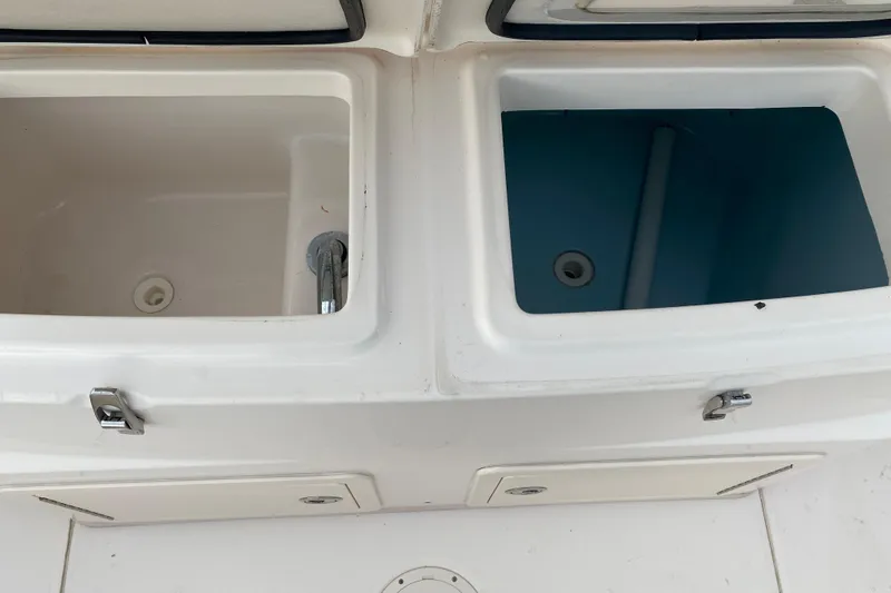  Yacht Photos Pics Livewell compartments on a 2018 Grady-White Canyon 306 boat, featuring dual storage areas.