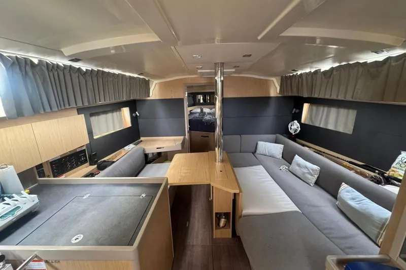 Bambino Yacht Photos Pics Interior of 2019 Beneteau Oceanis 41.1 yacht with modern seating and wooden finishes.