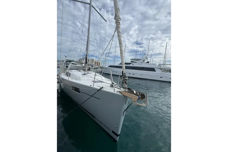 Bambino Yacht Photos Pics 2019 Beneteau Oceanis 41.1 sailboat docked in a marina under cloudy skies.