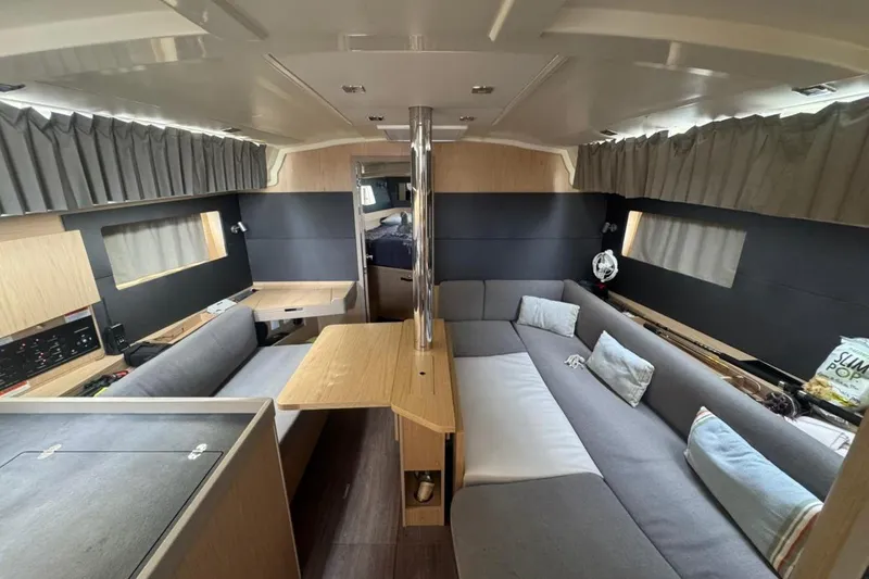 Bambino Yacht Photos Pics Interior of 2019 Beneteau Oceanis 41.1 yacht with modern seating and wooden accents.