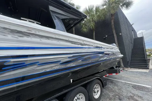  Yacht Photos Pics 2019 Nor-Tech 450 Sport Center Console boat with sleek design and blue accents, parked outdoors.