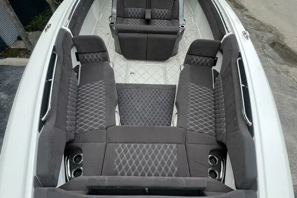  Yacht Photos Pics 2019 Nor-Tech 450 Sport Center Console with luxurious gray seating and diamond stitching.