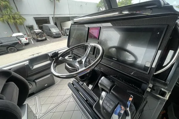  Yacht Photos Pics 2019 Nor-Tech 450 Sport Center Console dashboard with steering wheel and digital displays.