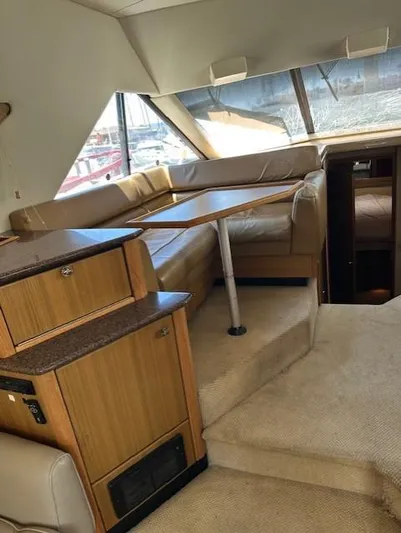  Yacht Photos Pics Interior of 2002 Bayliner 3988 Command Bridge Motoryacht with seating and table.