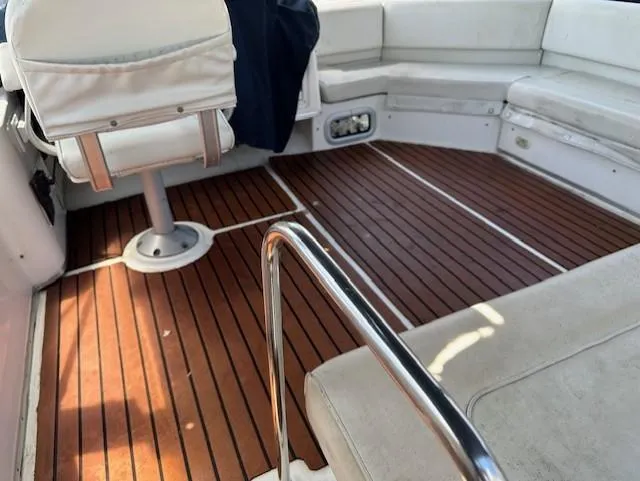  Yacht Photos Pics 2002 Bayliner 3988 Command Bridge Motoryacht interior with wooden deck and white seating.