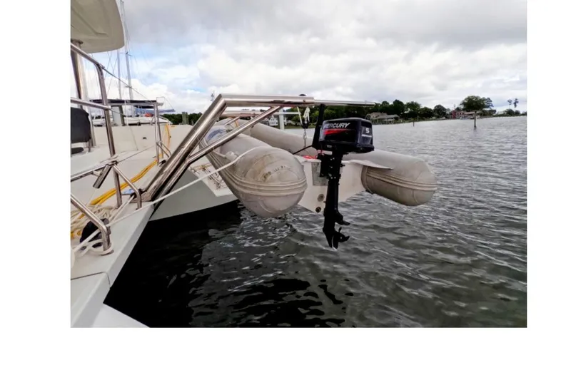 Rhapsody Yacht Photos Pics Lagoon 52 F yacht with inflatable dinghy and Mercury outboard motor, 2021 model.