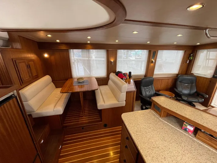 Pacific Rose Yacht Photos Pics Luxurious interior of a 2009 American Tug 49 Limited with elegant seating and wood finishes.
