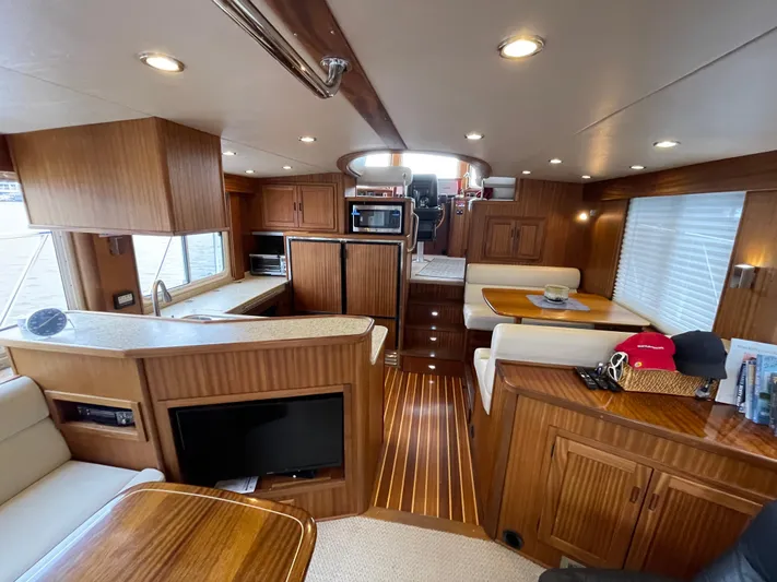 Pacific Rose Yacht Photos Pics Luxurious interior of 2009 American Tug 49 Limited with wood finishes and modern amenities.