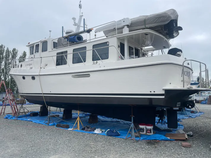 Pacific Rose Yacht Photos Pics 2009 American Tug 49 Limited yacht on dry dock, undergoing maintenance.