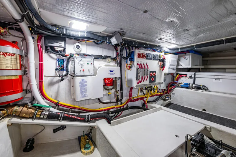Pacific Rose Yacht Photos Pics Engine room of 2009 American Tug 49 Limited, showcasing electrical systems and wiring.