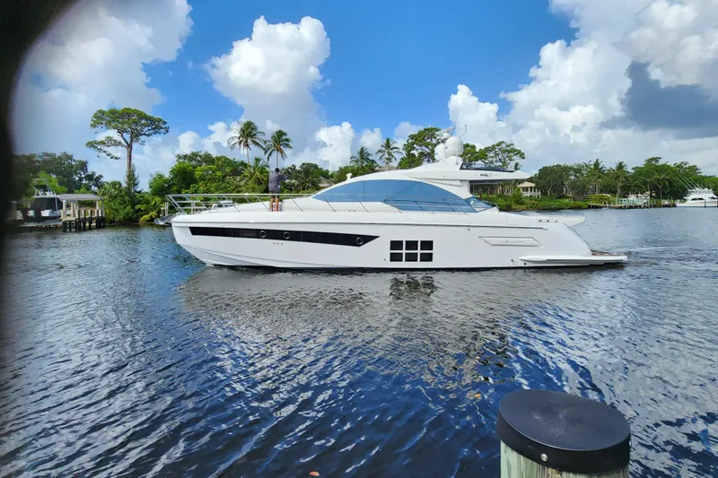 Pri Sea Yacht Photos Pics 2019 Azimut S6 yacht on a serene waterway with lush greenery.