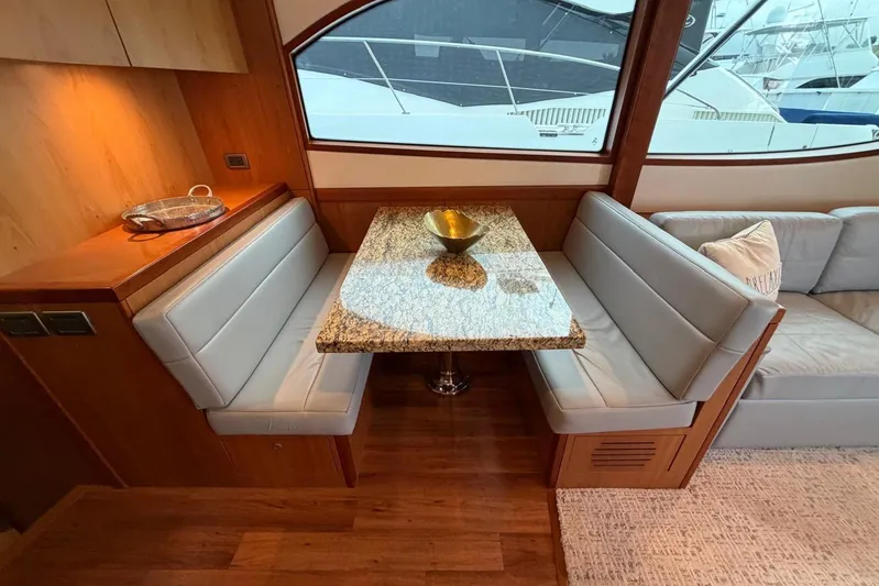  Yacht Photos Pics Luxurious 2011 Hatteras GT60 yacht interior with elegant dining area and granite table.