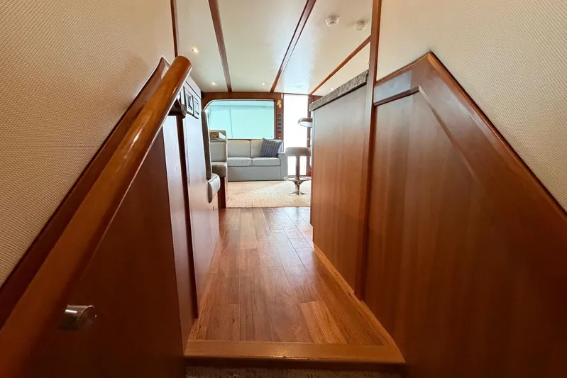  Yacht Photos Pics Interior of 2011 Hatteras GT60 yacht with wooden flooring and cozy seating area.