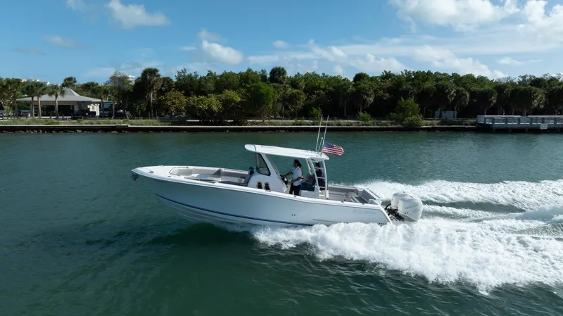  Yacht Photos Pics 2018 Belzona 325 Center Console boat cruising on a sunny day.