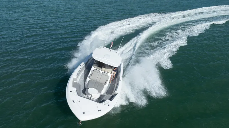  Yacht Photos Pics 2018 Belzona 325 Center Console boat cruising on open water.