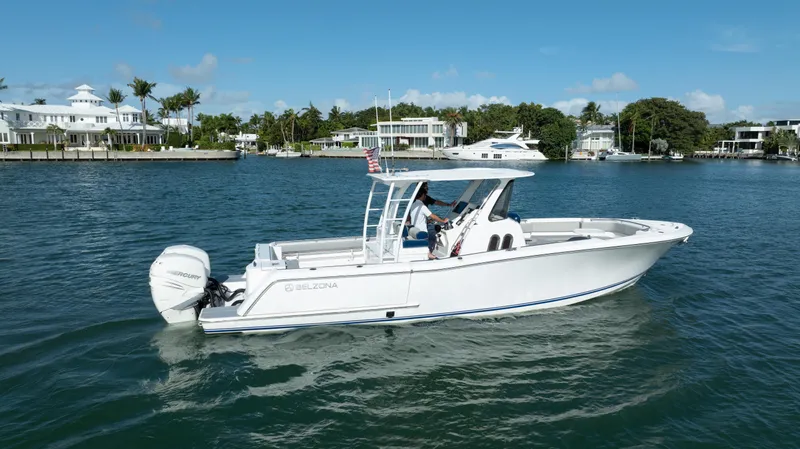  Yacht Photos Pics 2018 Belzona 325 Center Console boat cruising on a sunny day.