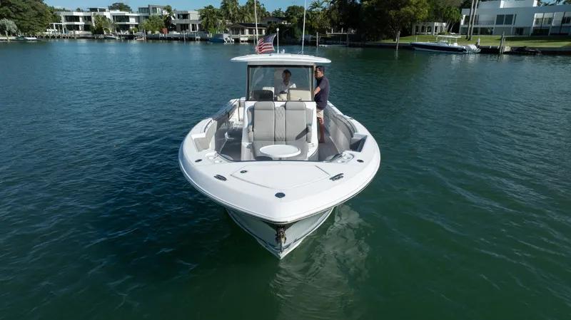  Yacht Photos Pics 2018 Belzona 325 Center Console boat cruising on a calm waterway.