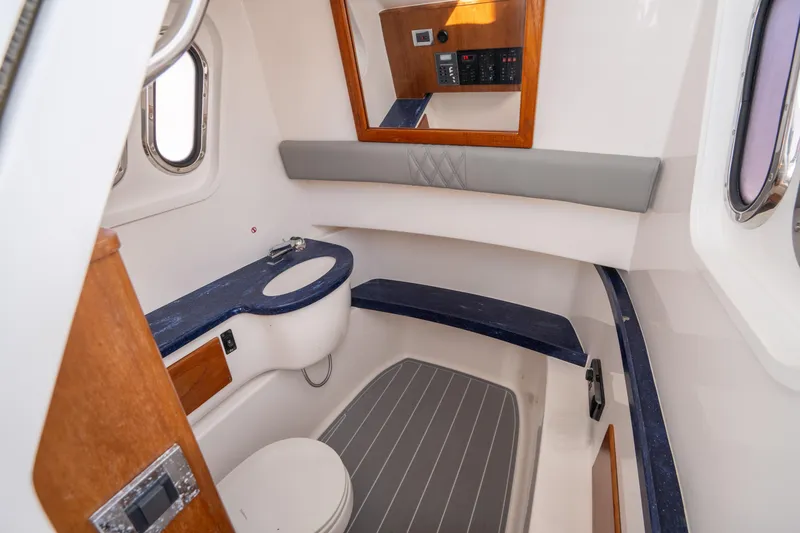  Yacht Photos Pics 2018 Belzona 325 Center Console cabin interior with modern amenities and sleek design.