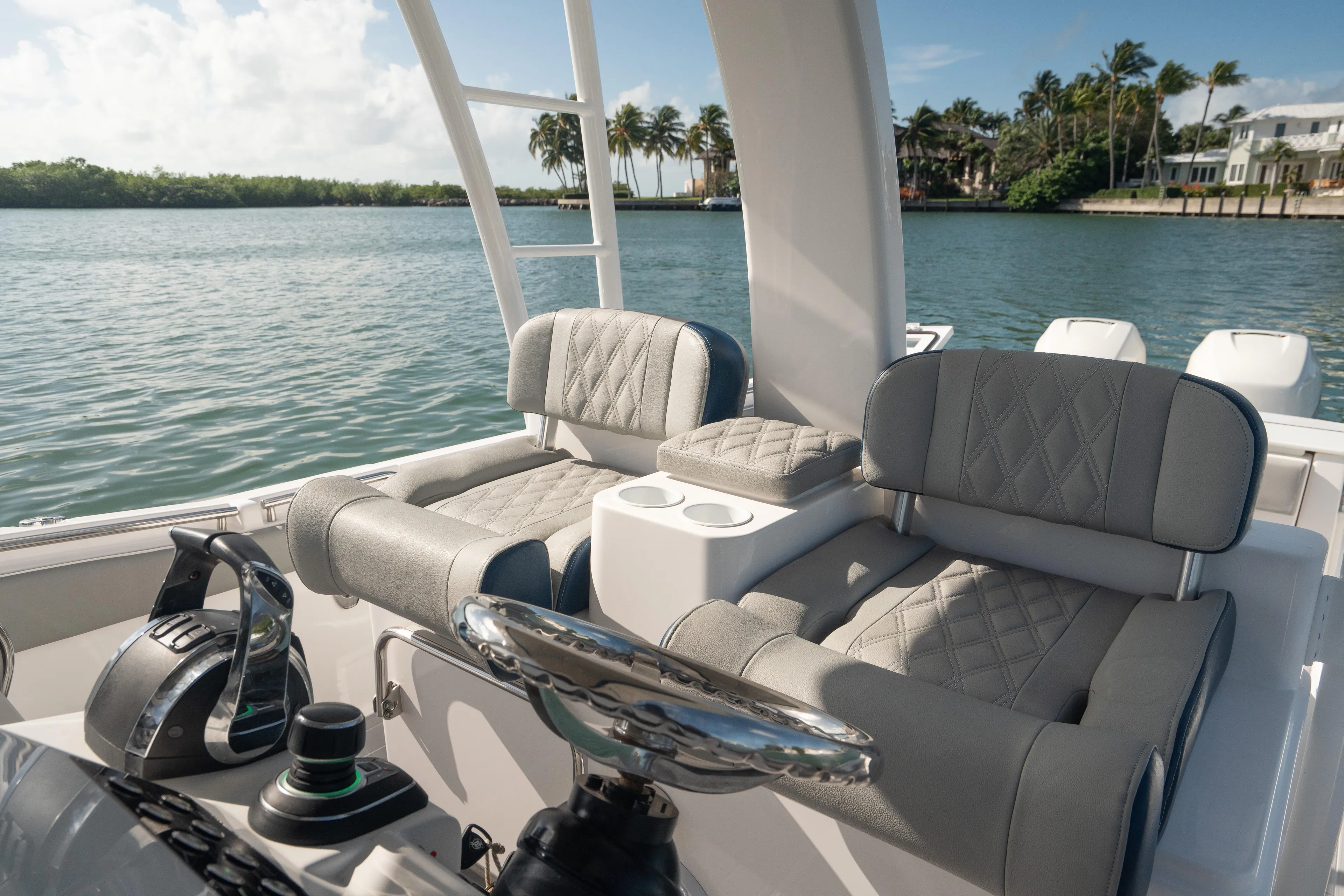  Yacht Photos Pics 2018 Belzona 325 Center Console boat interior with luxurious seating and steering wheel.