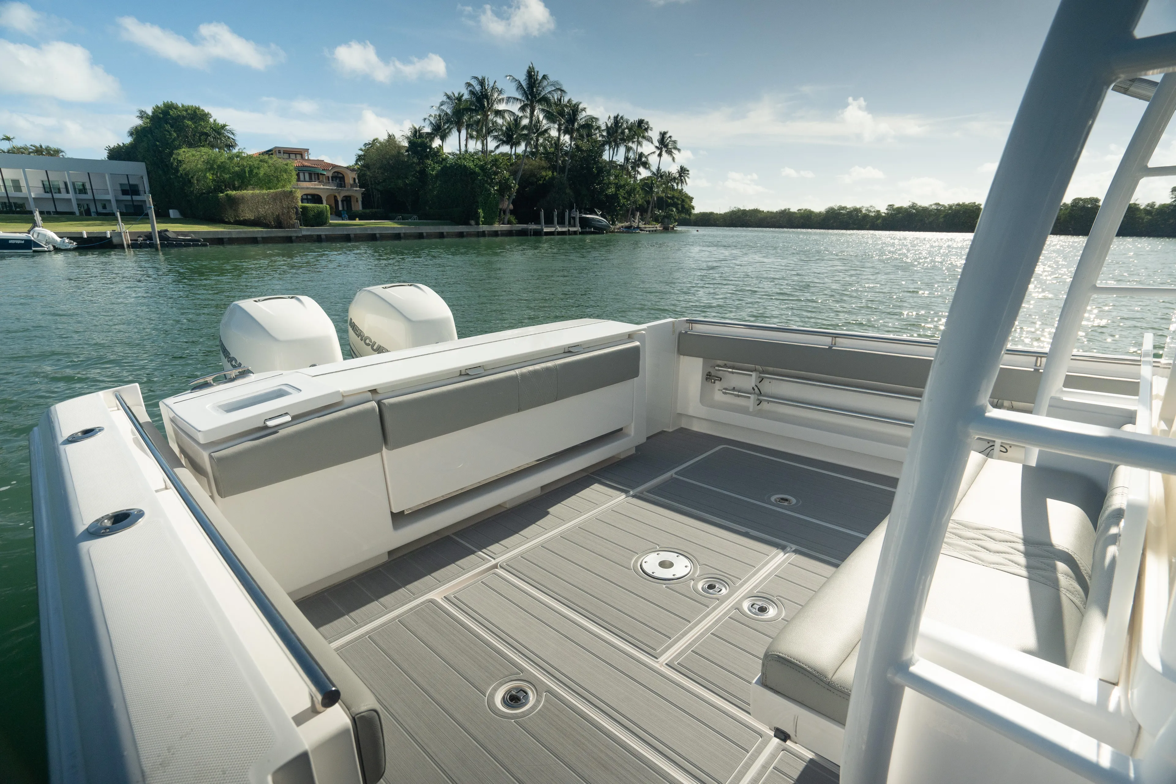 Yacht Photos Pics 2018 Belzona 325 Center Console boat on calm water, featuring spacious deck and twin engines.