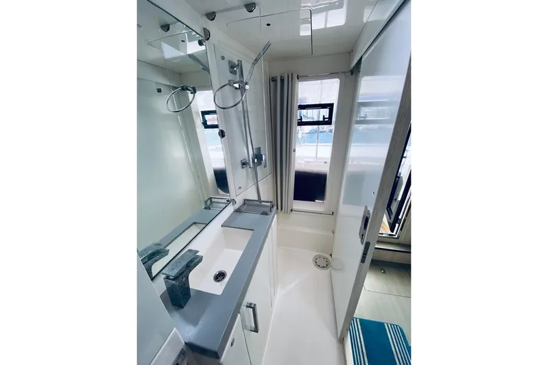  Yacht Photos Pics Modern bathroom in 2018 Leopard 58 yacht with sleek fixtures and shower.