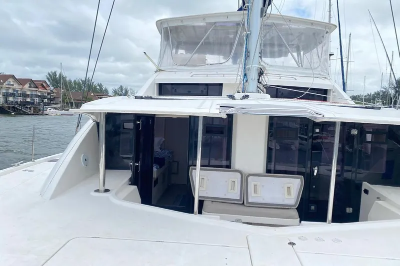  Yacht Photos Pics 2018 Leopard 58 yacht with spacious deck and modern design, docked at marina.