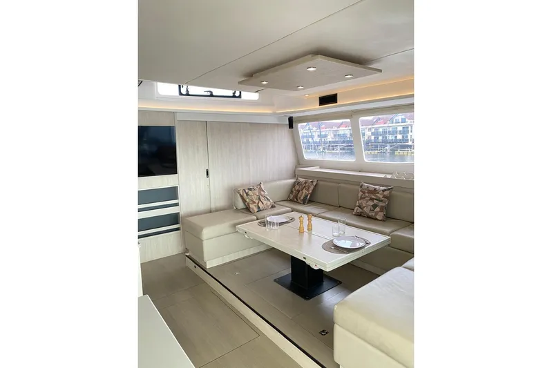  Yacht Photos Pics Luxurious 2018 Leopard 58 yacht interior with elegant seating and dining area.