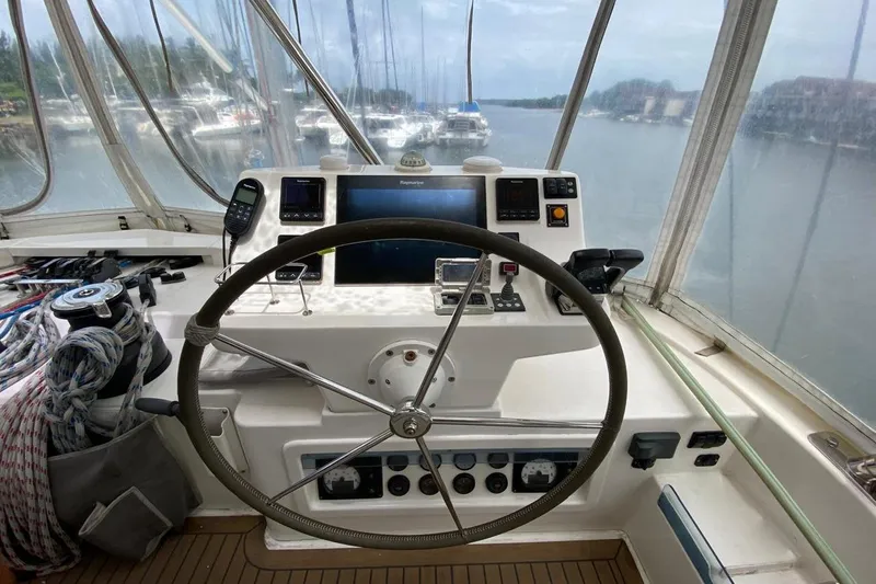  Yacht Photos Pics Helm of 2018 Leopard 58 yacht with navigation equipment and steering wheel.