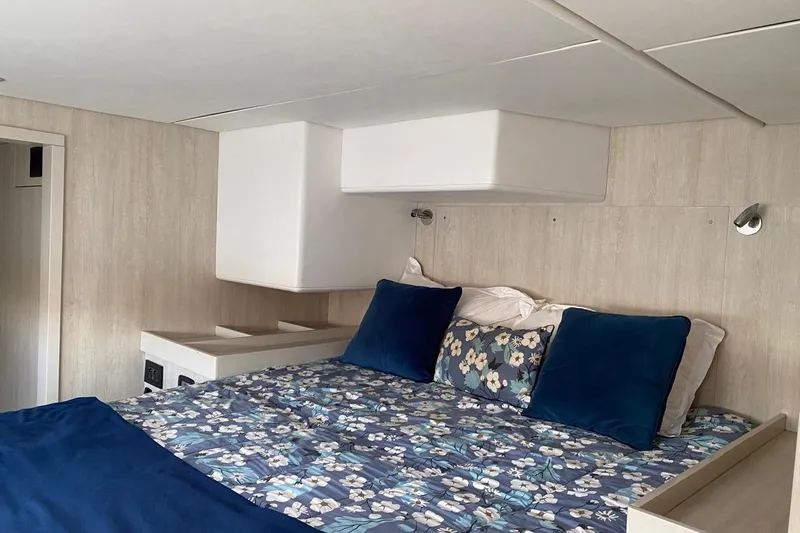  Yacht Photos Pics Luxurious bedroom interior in 2018 Leopard 58 yacht with floral bedding and modern lighting.