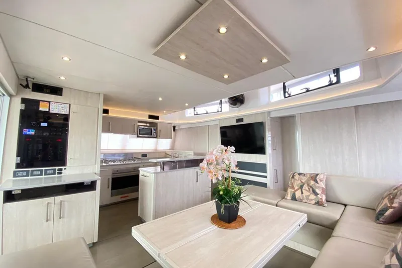  Yacht Photos Pics Luxurious interior of a 2018 Leopard 58 yacht with modern kitchen and seating area.