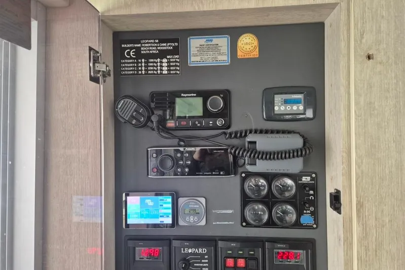  Yacht Photos Pics Control panel of a 2018 Leopard 58 yacht with various navigation and communication devices.