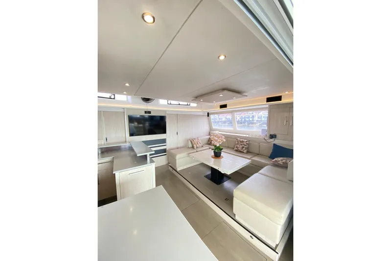  Yacht Photos Pics Luxurious interior of 2018 Leopard 58 yacht with modern seating and elegant decor.