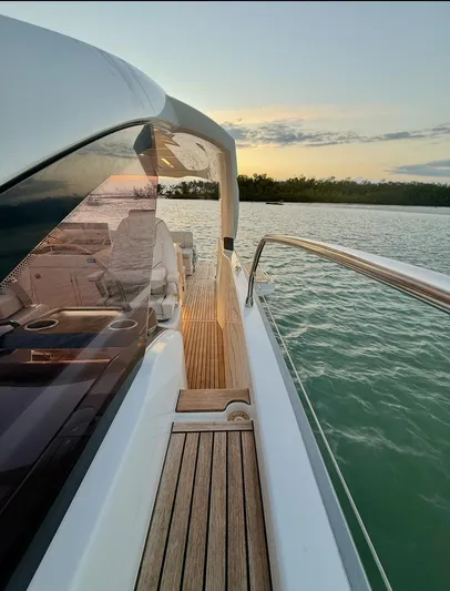  Yacht Photos Pics 2024 Jeanneau DB/43 OB yacht on serene water at sunset.