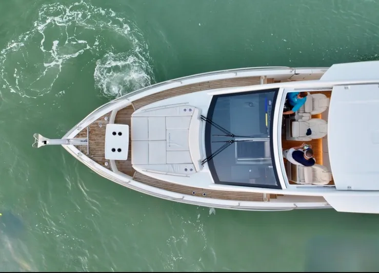  Yacht Photos Pics Overhead view of 2024 Jeanneau DB/43 OB yacht on green water.