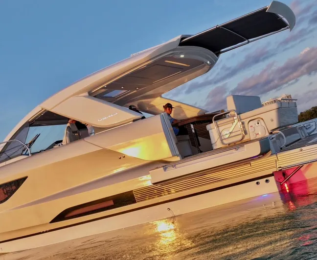  Yacht Photos Pics 2024 Jeanneau DB/43 OB yacht at sunset, featuring sleek design and modern amenities.