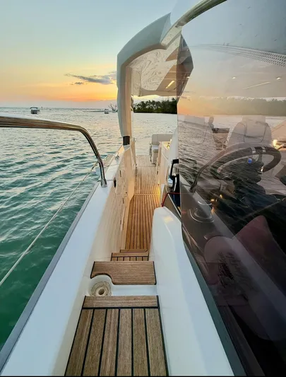  Yacht Photos Pics 2024 Jeanneau DB/43 OB yacht at sunset, featuring sleek deck design and serene ocean view.