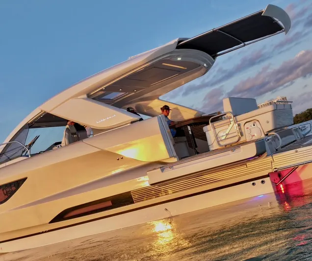  Yacht Photos Pics 2024 Jeanneau DB/43 OB yacht at sunset, featuring sleek design and modern amenities.