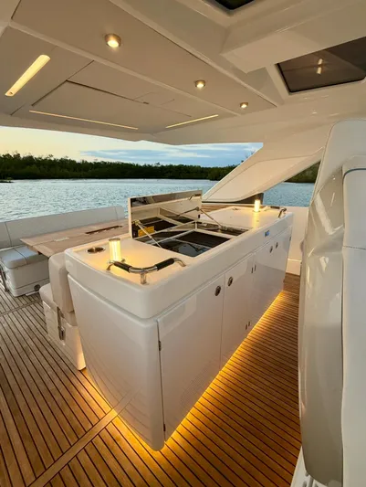  Yacht Photos Pics 2024 Jeanneau DB/43 OB yacht interior with modern kitchen and ambient lighting.