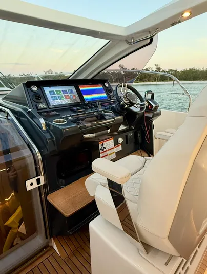  Yacht Photos Pics 2024 Jeanneau DB/43 OB boat cockpit with modern navigation system and comfortable seating.