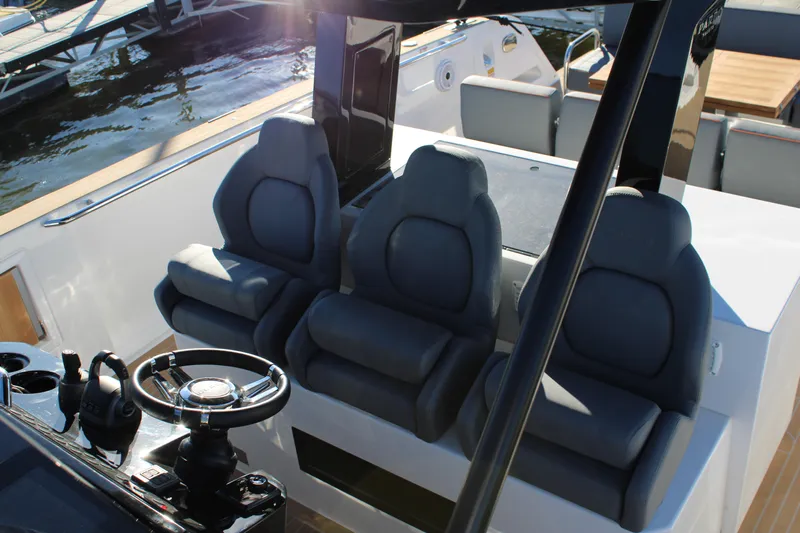  Yacht Photos Pics Luxury seating and helm of 2025 Pardo Yachts 38, showcasing modern design.