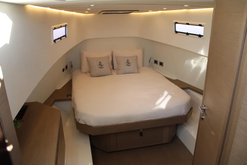  Yacht Photos Pics Luxurious cabin interior of 2025 Pardo Yachts 38, featuring a cozy bed and modern design.