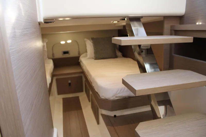  Yacht Photos Pics Luxurious interior of 2025 Pardo Yachts 38, featuring modern twin beds and sleek wooden finishes.