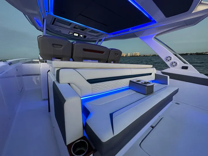  Yacht Photos Pics Luxurious 2020 Tiara Yachts 43 LS interior with modern seating and ambient blue lighting.