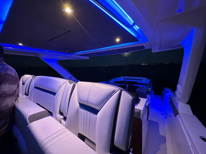  Yacht Photos Pics 2020 Tiara Yachts 43 LS interior with blue ambient lighting at night.