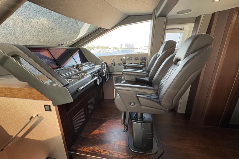  Yacht Photos Pics Luxurious helm of 2018 Sunseeker 86 Yacht with leather seats and advanced controls.