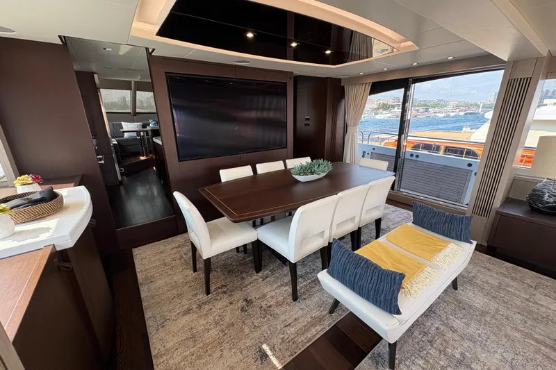  Yacht Photos Pics Luxurious interior of 2018 Sunseeker 86 Yacht with elegant dining area and large windows.